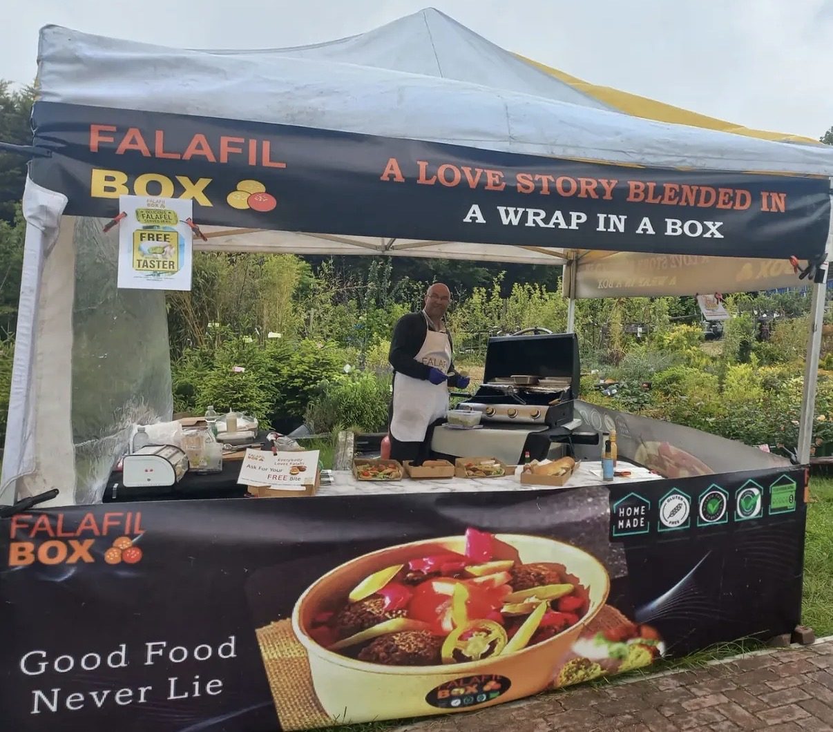 Falafel Box market stall with branded counter and fresh food service
