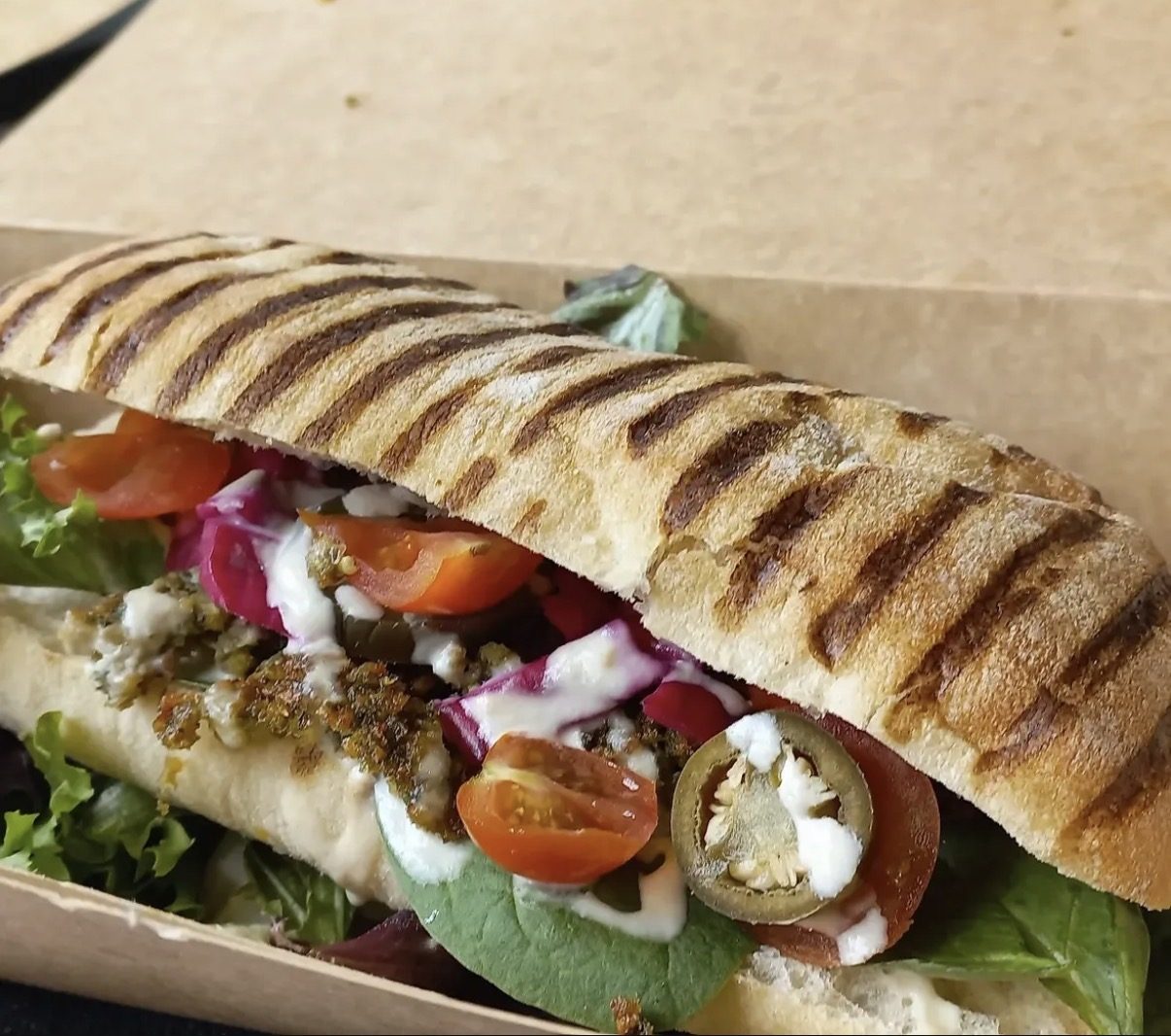 Fresh falafel wrap with salad, sauce and grilled bread